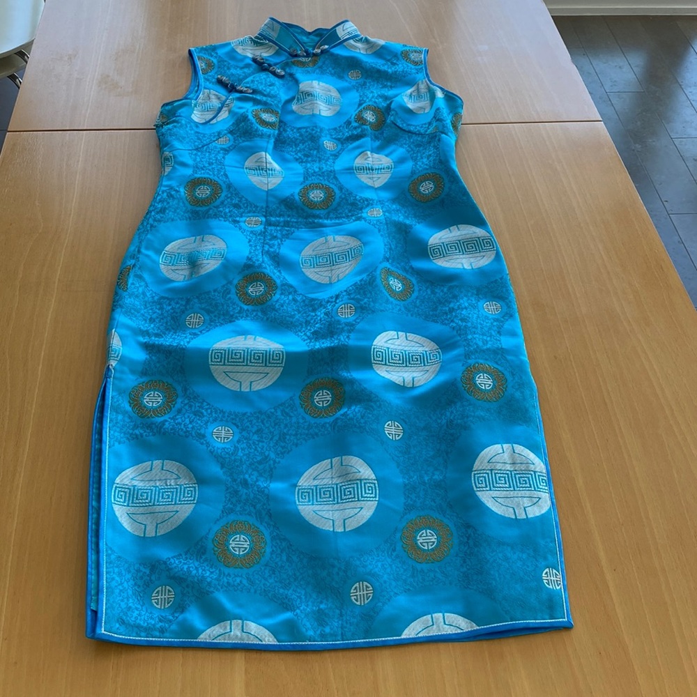 Qipao. Traditional Chinese dress in turquoise.